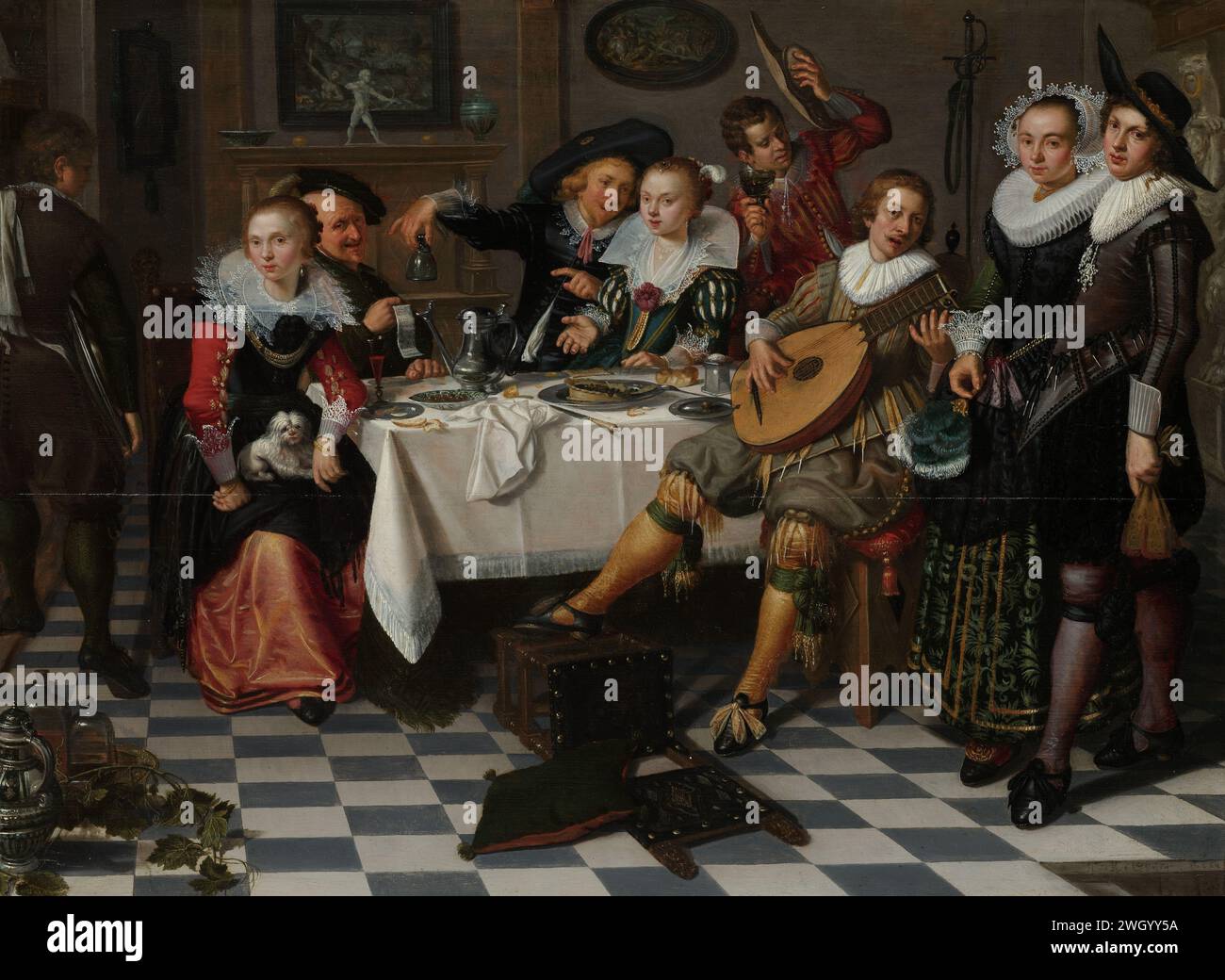 Merry Company, Isack Elyas, 1629 Painting Party célébrant la compagnie. Intérieur avec une fête célébrant, buvant et faisant de la musique entreprise autour d'une table. Sur la gauche se trouve une femme avec un chien sur les genoux, aussi un vieil homme avec une chanson ou un poème à la main. Au milieu, il y en a quelques-uns, dont le jeune homme tient un verre vide à l'envers, un homme qui joue du luth devant. A droite, un homme et une femme. Au premier plan une chaise tombée, sur la table une tarte cassée, un bol avec des baies, une cruche, des assiettes et des verres. Il y a deux peintures sur le mur. panneau. banquet de peinture à l'huile (peinture) d'elegan Banque D'Images