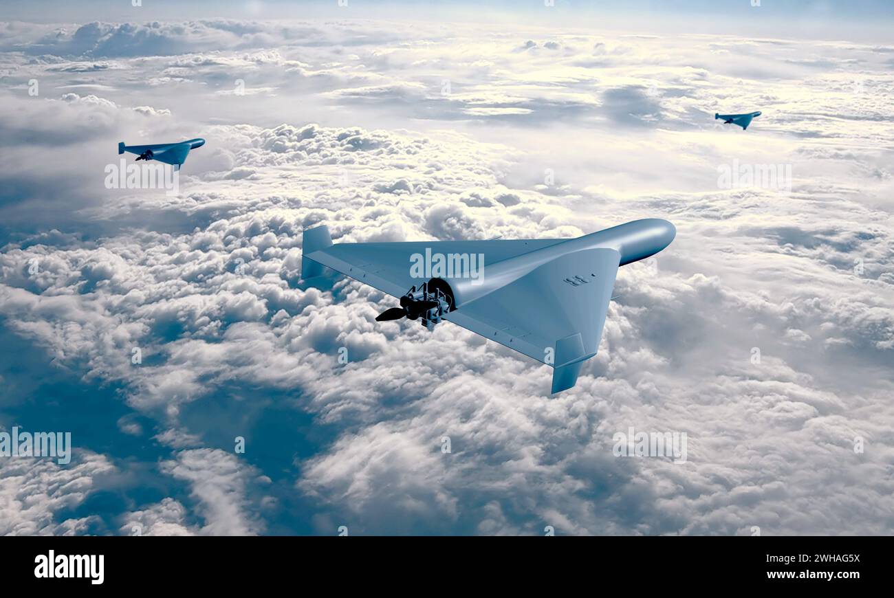 Un groupe de trois drones de combat kamikaze volant sur fond de ciel et de nuages, attaque et approche de cible d'UAV, guerre en Ukraine et en Russie. Banque D'Images