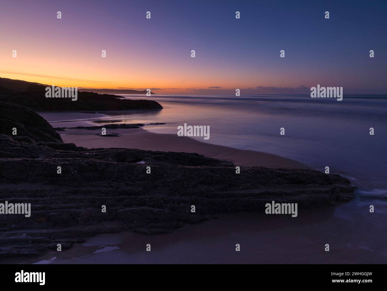 Lever de soleil sur Tregantle Beach Banque D'Images