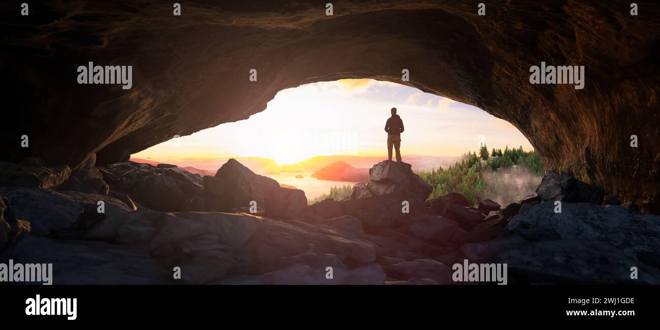 Un homme debout à l'entrée de la grotte admirant le coucher de soleil vibrant Banque D'Images