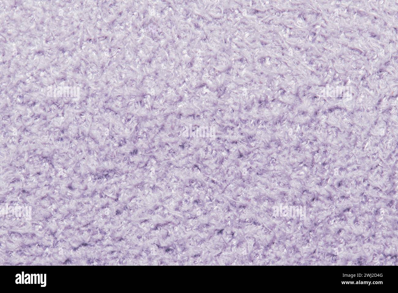 Cette image capture la texture détaillée d'un tissu doux de couleur lavande qui semble moelleux et confortable. Banque D'Images Cette image capture la texture détaillée d'un tissu doux de couleur lavande qui semble moelleux et confortable. Banque D'Images