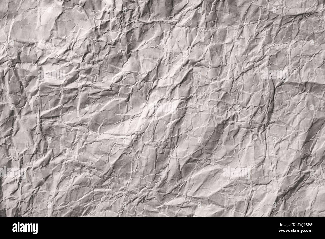 Texture de papier froissé gris comme fond. Banque D'Images