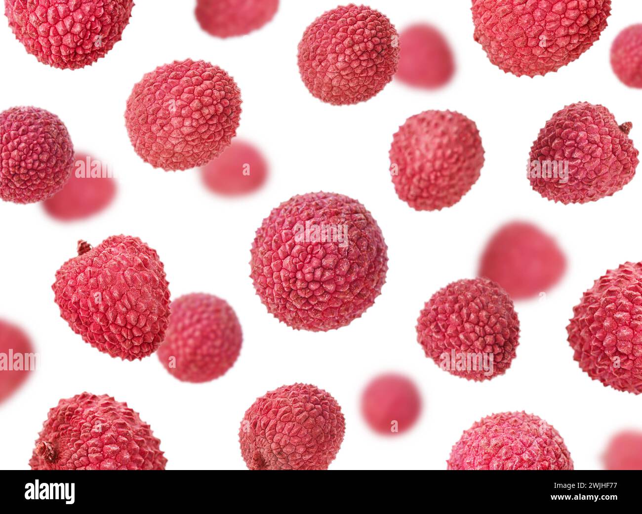 Litchi tombant, isolé sur fond blanc, foyer sélectif Banque D'Images