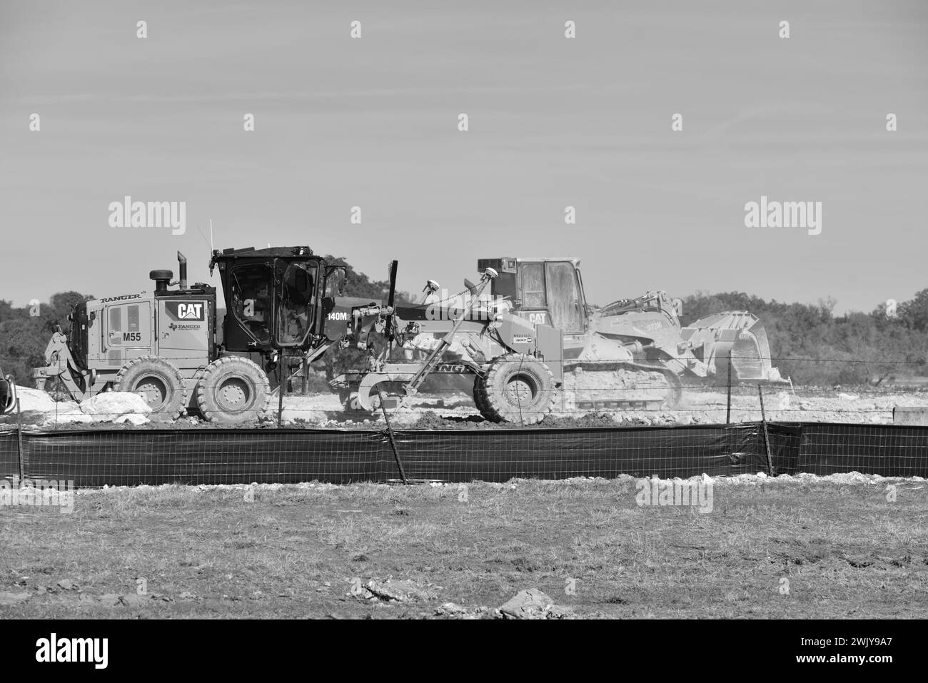 Nivellement des collines dans des lots de maisons pour le développement de la densité dans le comté rural de Comal, Texas Banque D'Images