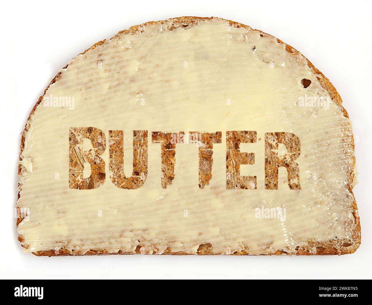 Texte fait avec du beurre sur une tranche de pain. Banque D'Images