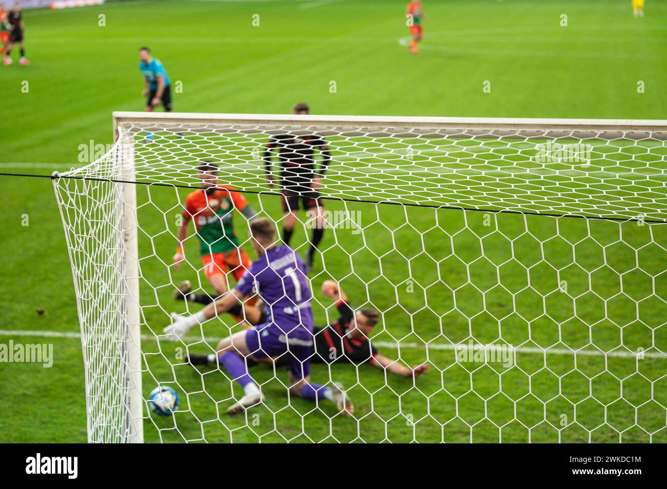 Filet de but de football et action sous le but en arrière-plan Banque D'Images