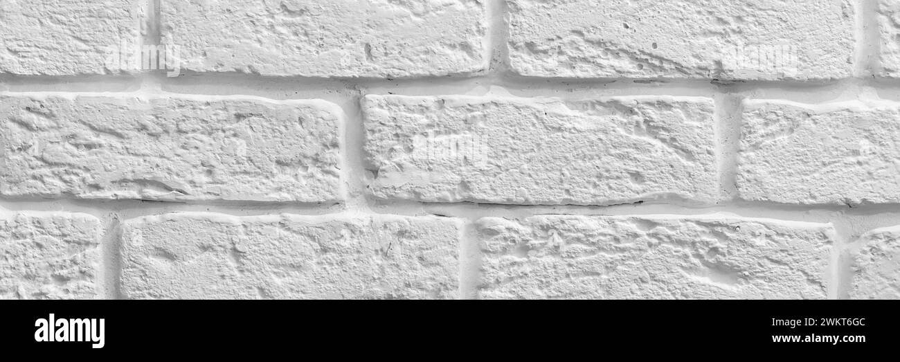 Bannière décorative de texture de fond de mur de brique blanche rugueuse. En-tête de bande panoramique. Fond d'écran large. Banque D'Images