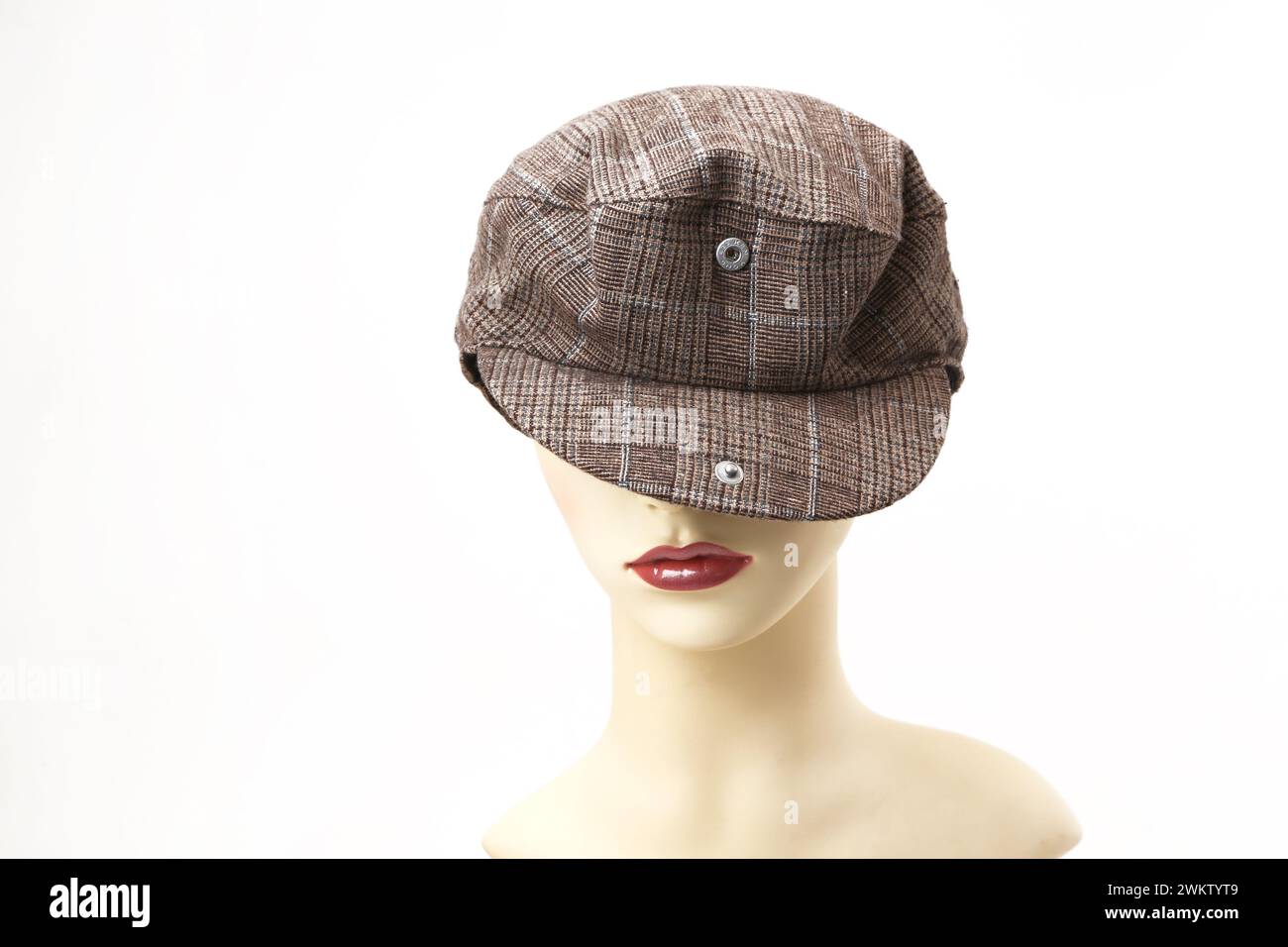Casquette plate en tweed avec Popper fixée sur la visière Banque D'Images