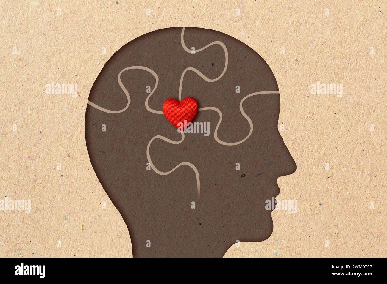 Profil silhouette de l'homme avec des pièces de puzzle et le coeur - concept de psychologie, l'amour et la santé mentale Banque D'Images