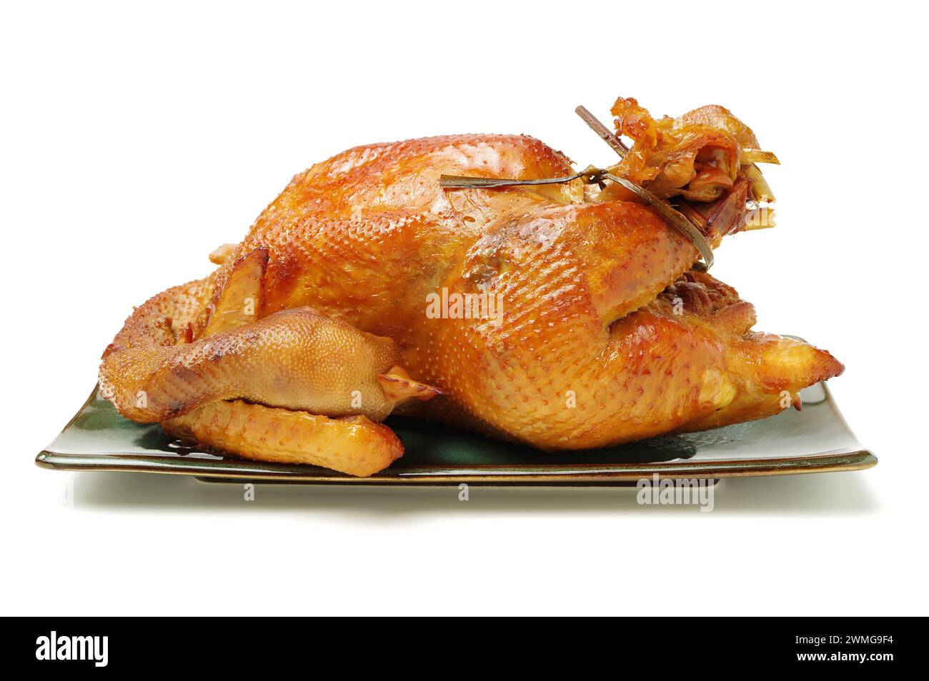 Poulet rôti sur fond blanc Banque D'Images