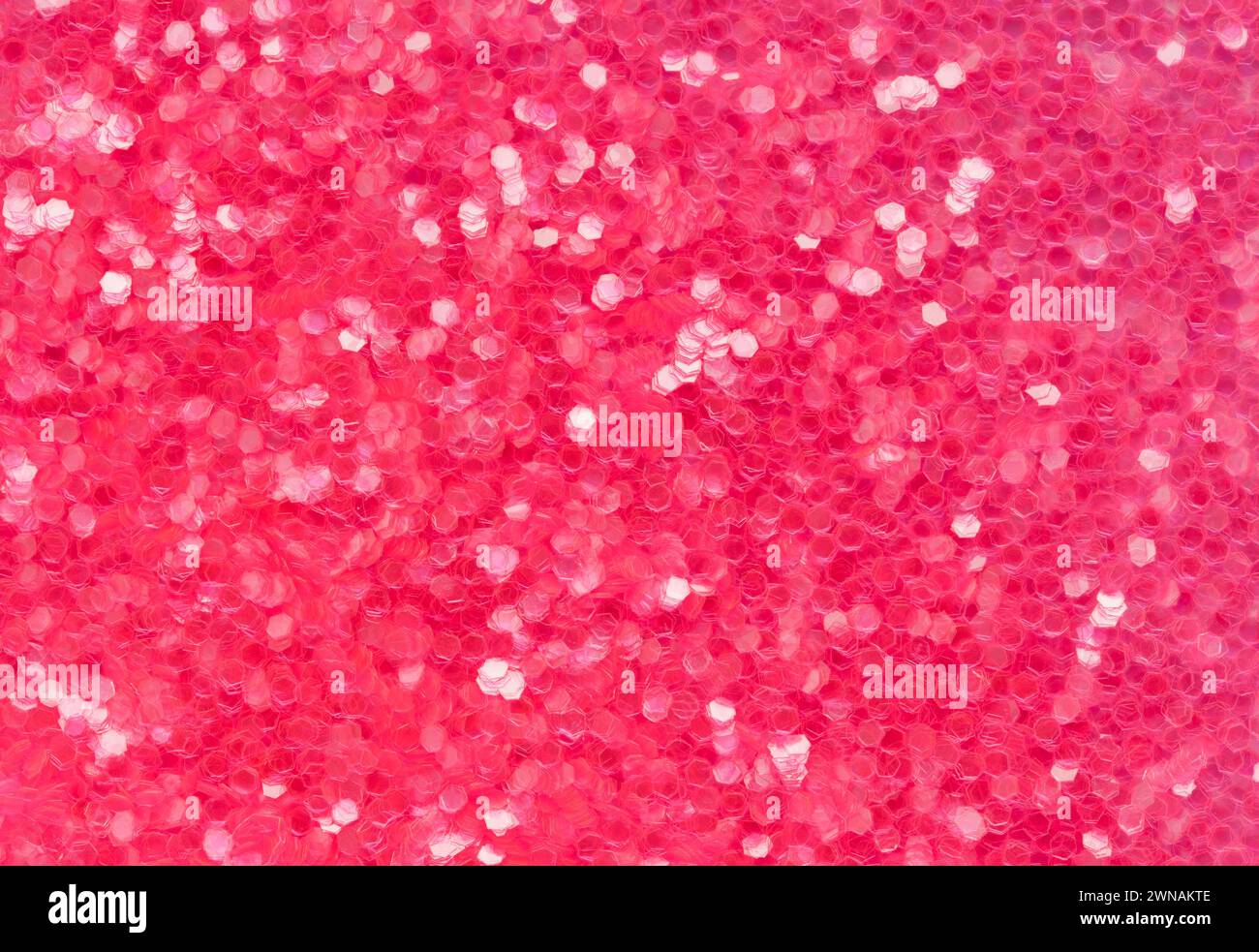 Texture de fond de pile rouge et rose à paillettes gros plan. Banque D'Images