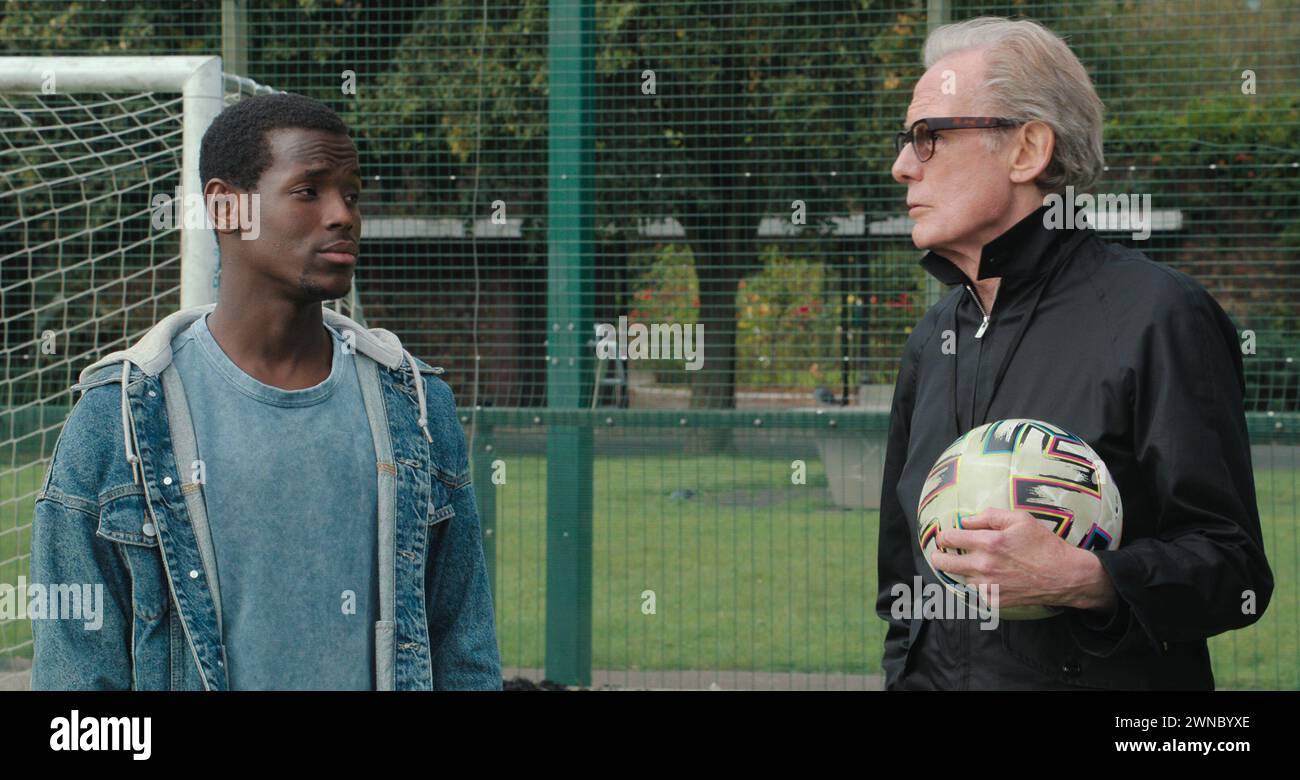 DATE DE SORTIE : 29 mars 2024. TITRE : le beau jeu. STUDIO : Netflix. RÉALISATEUR : Thea Sharrock. INTRIGUE : défenseurs de mettre fin à l'itinérance, organiser un tournoi annuel pour les hommes sans-abri à concourir est une série de matchs de football connu sous le nom de Coupe du monde sans-abri. EN VEDETTE : MICHEAL WARD dans le rôle de Vinny, BILL NIGHY dans le rôle de mal. (Crédit image : © Netflix/Entertainment Pictures/ZUMAPRESS.com) USAGE ÉDITORIAL SEULEMENT ! Non destiné à UN USAGE commercial ! Banque D'Images