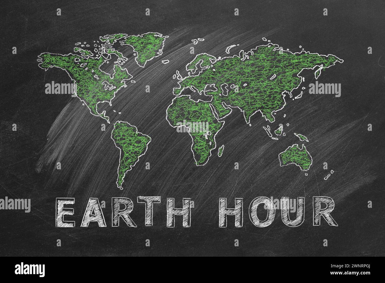 Carte du monde avec lettrage EARTH HOUR main dessinée à la craie sur un tableau noir de l'école. Sauvez le monde. Sauvez notre planète. Banque D'Images