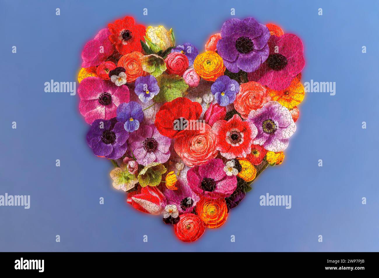 Un puzzle floral en forme de coeur Banque D'Images