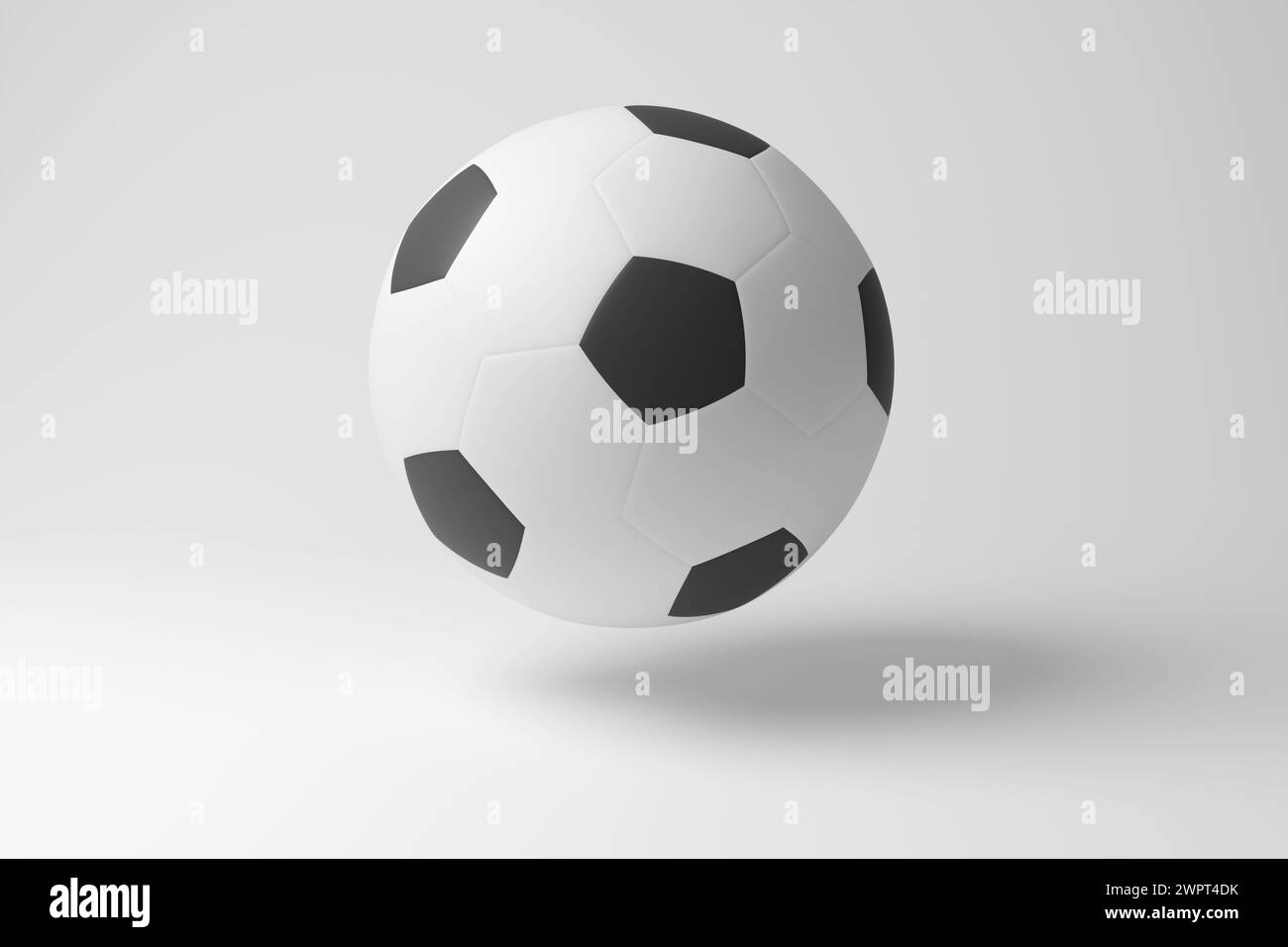 Ballon de football blanc flottant dans l'air en fond blanc en monochrome et minimalisme. Illustration du concept de sports d'équipe et tournoi de football Banque D'Images