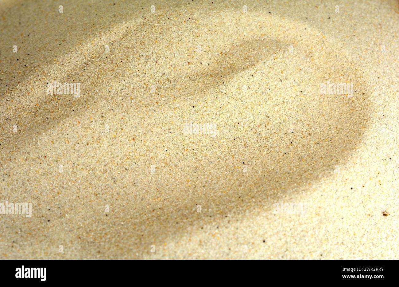 La texture du sable. Plage de sable pour l'arrière plan. Banque D'Images