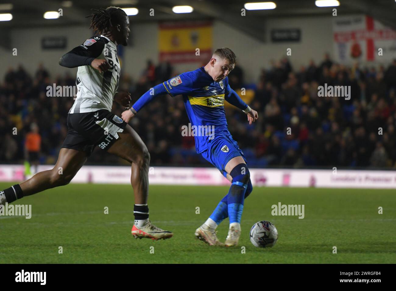 Londres, Angleterre. 12 mars 2024. Ronan Curtis de l'AFC Wimbledon tire pendant le match Sky Bet EFL League Two entre l'AFC Wimbledon et Gillingham. Kyle Andrews/Alamy Live News Banque D'Images