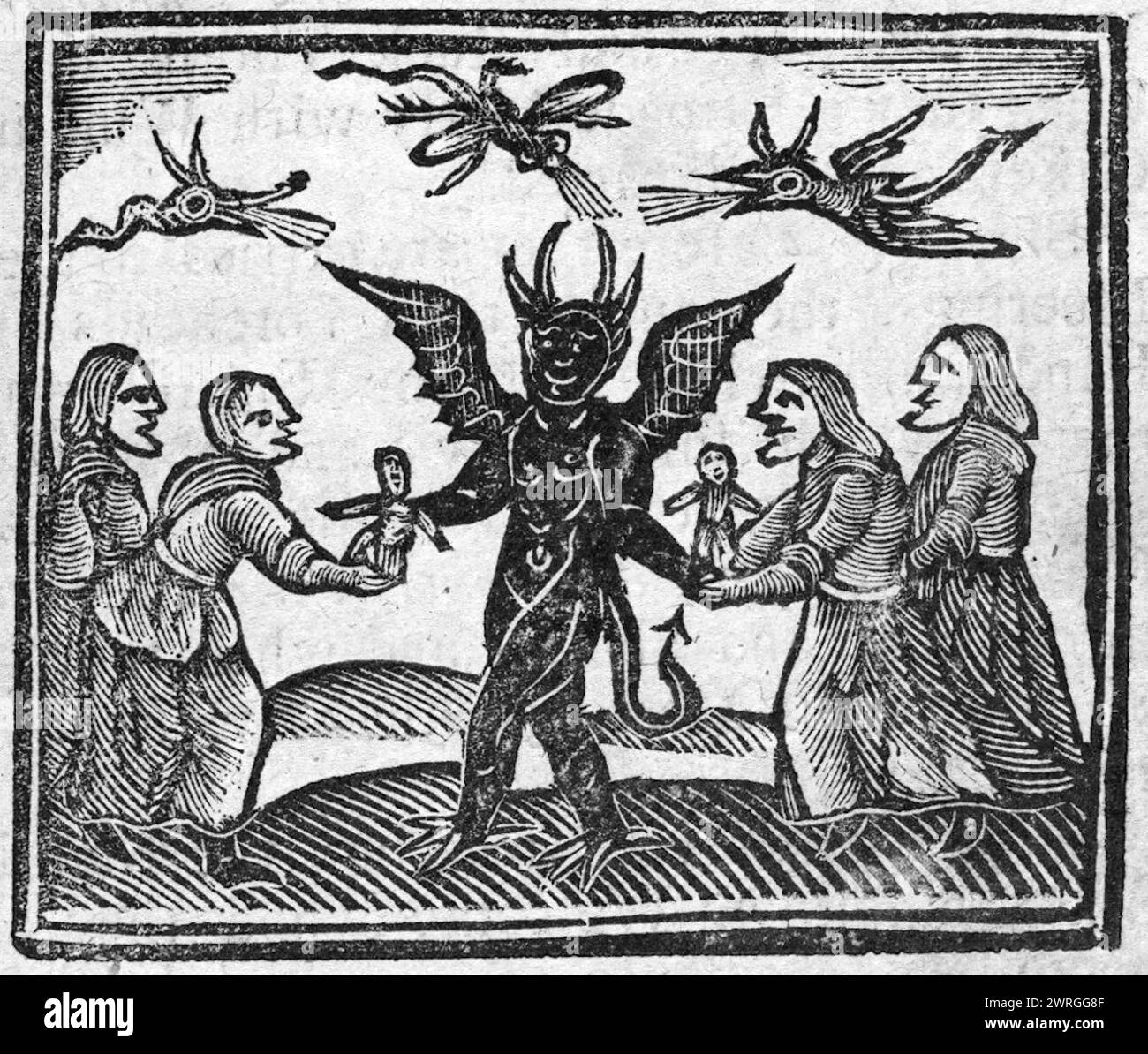 SORCIÈRES donnant des modèles de cire au diable dans une gravure sur bois du XVIIe siècle Banque D'Images