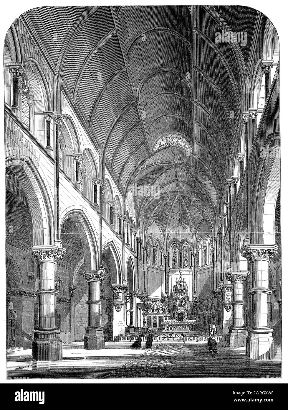 La nouvelle cathédrale catholique romaine à York, 1864. Intérieur de '...le lieu de culte le plus important et le plus somptueux érigé par les catholiques romains en Grande-Bretagne...Une nef spacieuse et un chœur, des allées latérales, une chapelle de Dame, une tour s'élevant à la hauteur de 150 pieds. Et former un baptistère, une maison capitulaire, et des vestes pratiques, offrent tout le logement nécessaire... plusieurs fenêtres sont remplies de vitraux fins, et le toit voûté du chœur est richement éclairé. Dans le maître-autel... apparaissent les nombreux Patriarches de l'ancienne Loi dont les vies sont typiques du Messie, avec quatre vies Banque D'Images