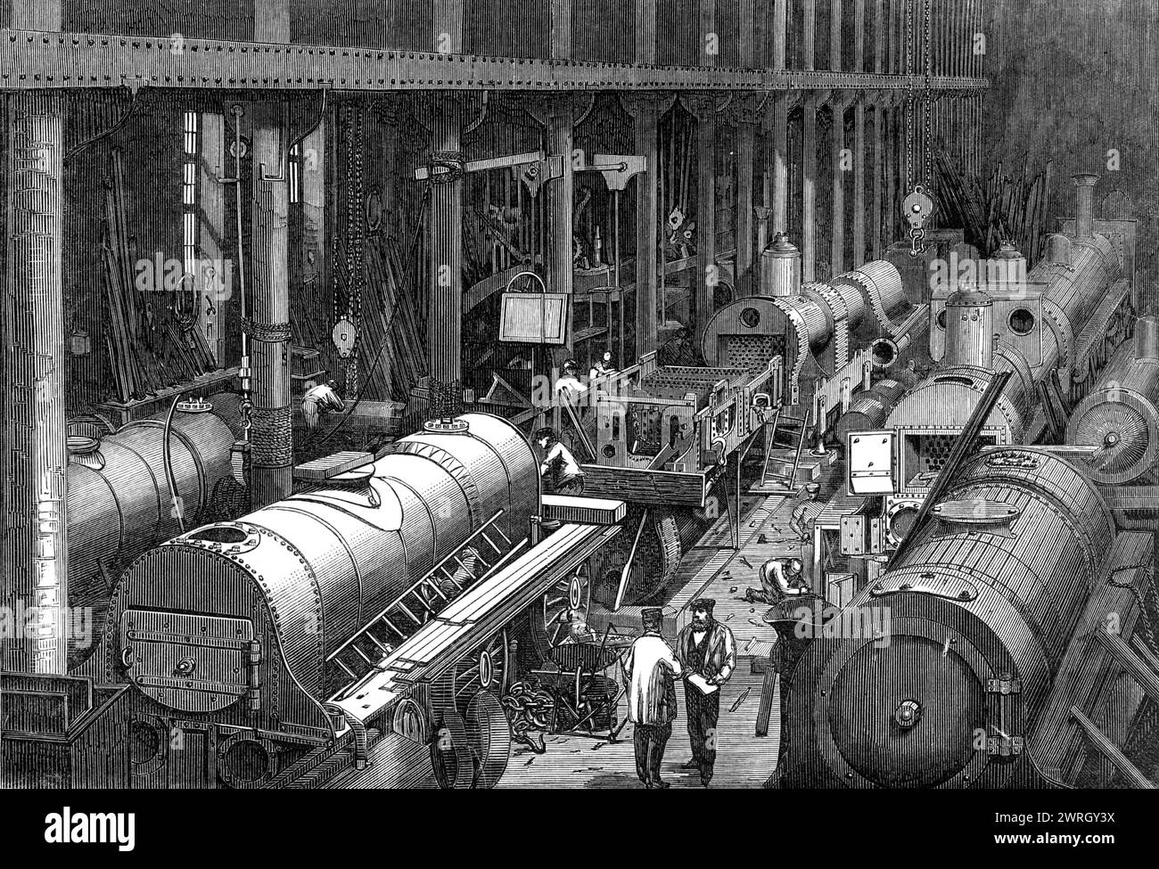 Stephenson's locomotive Manufacture à Newcastle-on-Tyne : The Fitting shop, 1864. '...une vue du grand bâtiment appelé "l'atelier d'essayage". C'est ici qu'une fois que toutes les parties distinctes de la locomotive ont été construites et terminées, chacune dans son service distinct, toutes sont rassemblées et placées dans leur position relative appropriée par une classe d'ouvriers hautement qualifiés appelés installateurs. Sous les mains de ces hommes la locomotive grandit rapidement ; le châssis est assemblé ; le travail du chaudronneur trouve sa place ; l'axe de manivelle et le cylindre les occupent dans la bonne position ; pi Banque D'Images