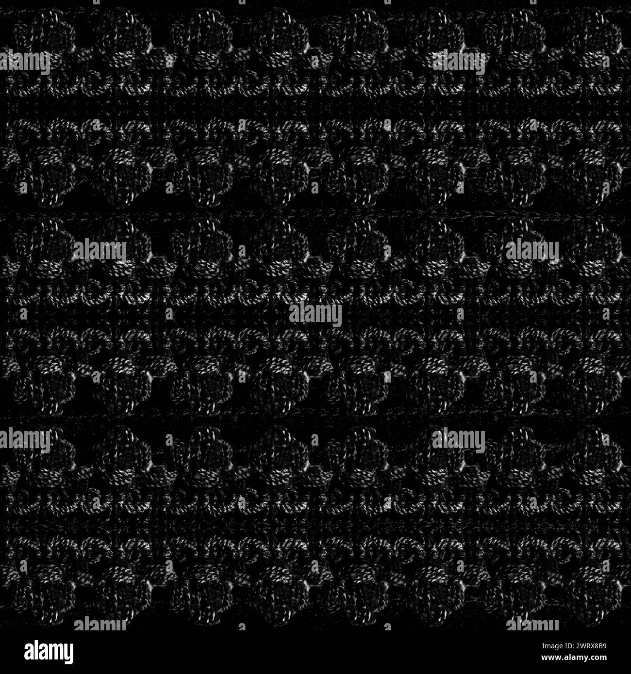 Photo de texture sans couture de motif de dentelle de couleur noire sur fond noir. Banque D'Images
