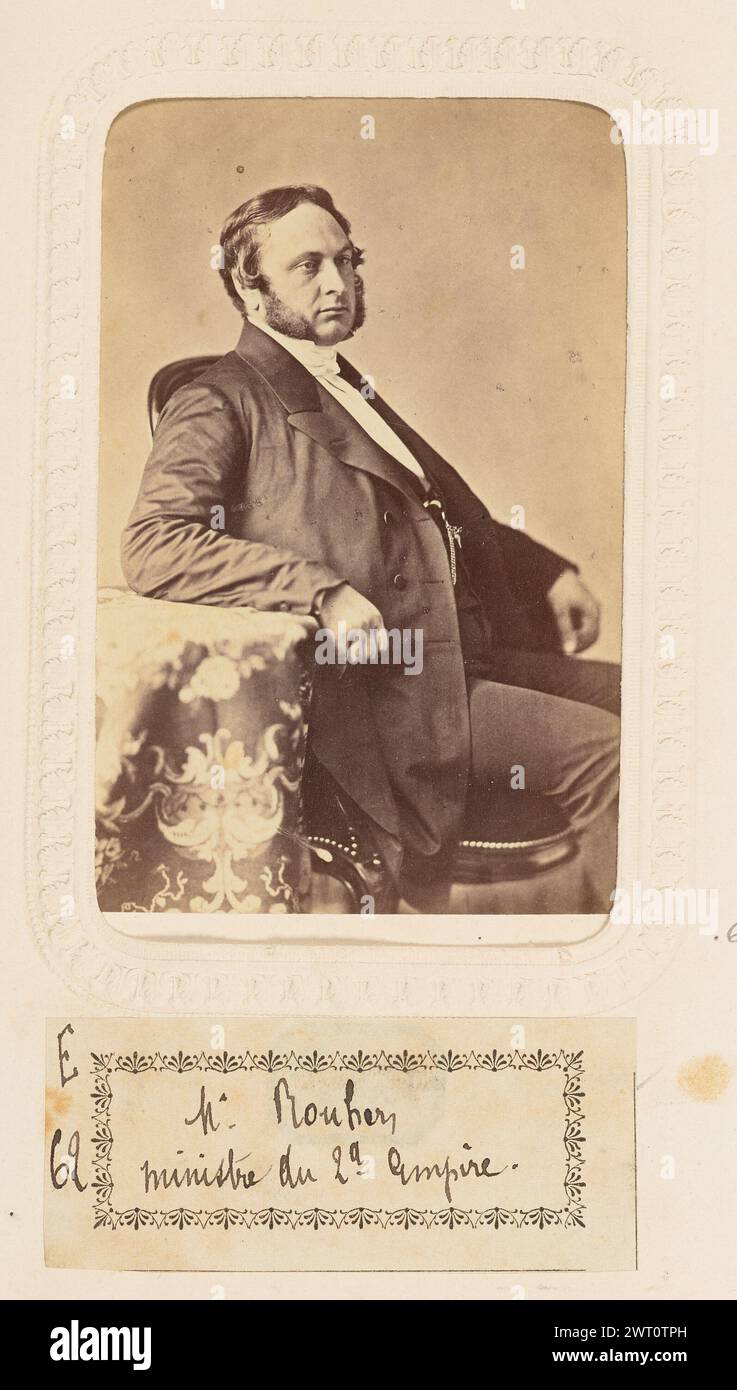 Rouher. Pierre Louis Pierson, photographe (1822 - 1913) 1856 Portrait d'Eugène Rouher, ministre de la Justice du second Empire. Il est assis à côté d'une petite table recouverte d'un tissu à motifs. Il a un bras reposant sur la table. (Recto, monture) partie inférieure centrale, typographie noire : 'L. PIERSON, PHOT./dépôt [space] garanti d'aprés nature' ; (verso, monture) partie supérieure gauche, encre noire : 'Rouher' ; partie centrale, empreinte noire du fabricant : 'PIERSON/seul propriétaire de la Mon./MAYER & PIERSON/PHOTOGRAPHES DE S.M.L'EMPEREUR/Boulevart des Capucines, 3./PARIS' ; texte imprimé en noir au centre inférieur : 'les Banque D'Images