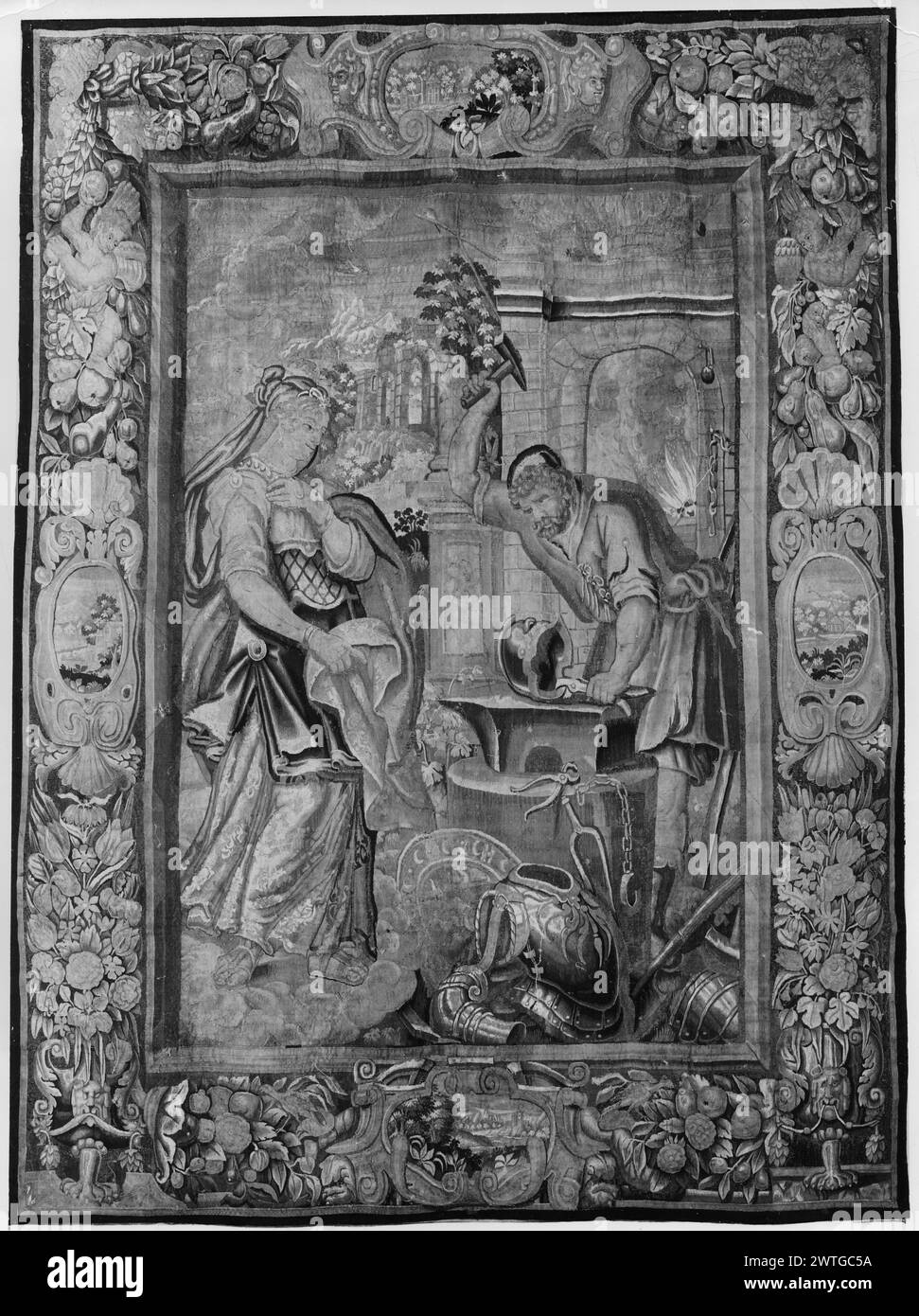 Thetis visite la forge de Vulcan Héphaïstus. Inconnu c. 1625-1650 dimensions de tapisserie : H 10'10' x l 8'2' tapisserie matériaux/techniques : inconnu culture : Centre de tissage flamand : Bruxelles historique de propriété : Français & Co. acheté à Eames MacVeigh, facturé le 26/01/1939. Casque de martelage vulcain (R du centre, premier plan) ; Thetis se tient devant Vulcan, tas d'armure sur le sol à côté d'elle (l du centre, premier plan) ; feu de forge (R, arrière-plan) ; paysage avec des ruines de bâtiments (l, arrière-plan) (BRD) grandes guirlandes de fleurs et de fruits; (l & R BRD) cartouches centrales avec paysages, au fond masque des lions Banque D'Images
