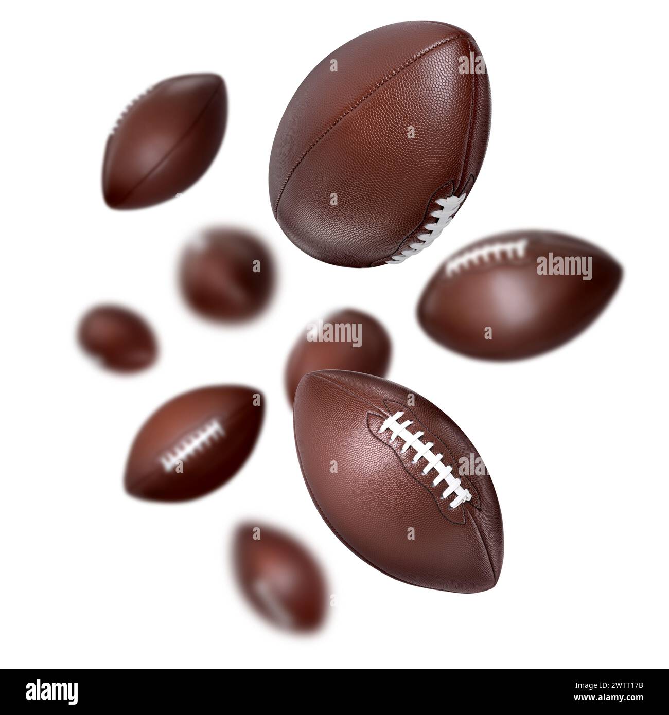 Balles de football américain tombant sur fond blanc Banque D'Images