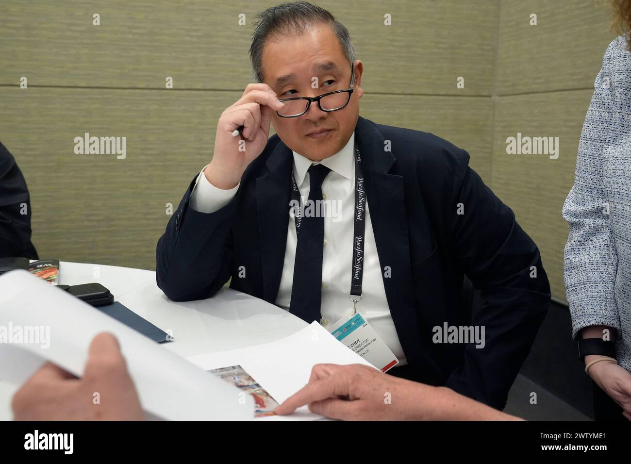 Eric Choy, executive director at U.S. Customs and Border Protection's office of trade, speaks during an interview at the North American Seafood Expo, Monday, March 11, 2024, in Boston. Choy says the CBP does investigate allegations of abuse. “You’d hope that there was a magic button that you can push and then everything created by forced labor is prohibited from entering, but it’s a much harder task. ... It does require us to follow the trail.” (AP Photo/Steven Senne) Banque D'Images