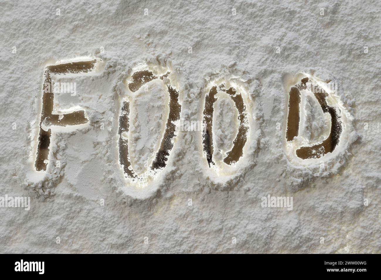 Inscription alimentaire sur farine blanche, vue de dessus, gros plan Banque D'Images