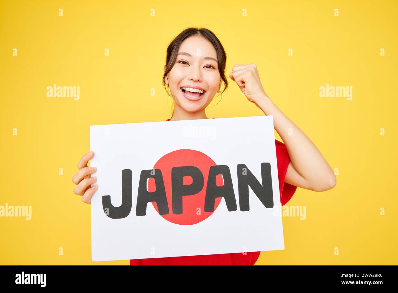 Femme asiatique tenant le signe du Japon Banque D'Images