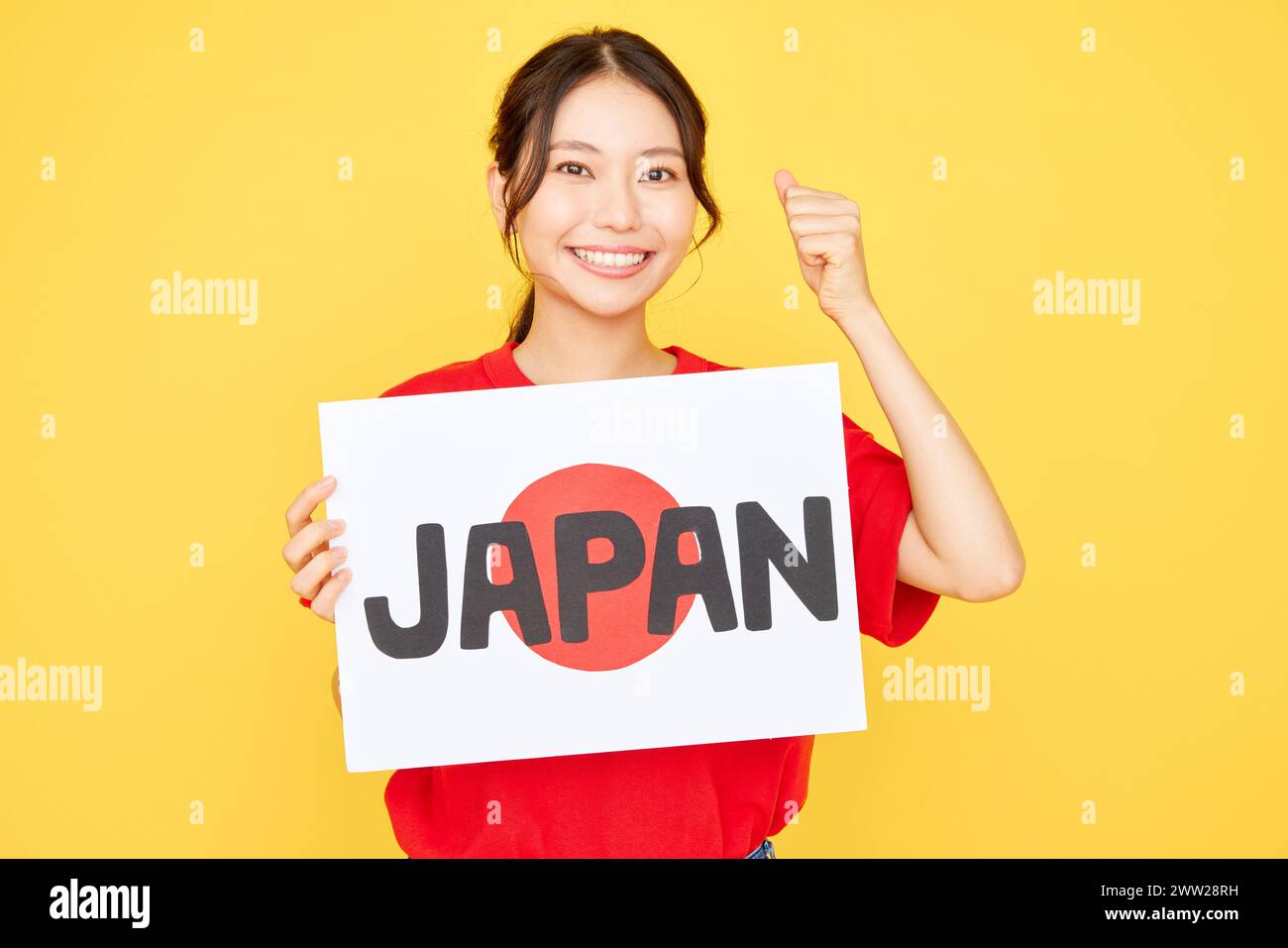 Femme asiatique tenant le signe du Japon Banque D'Images