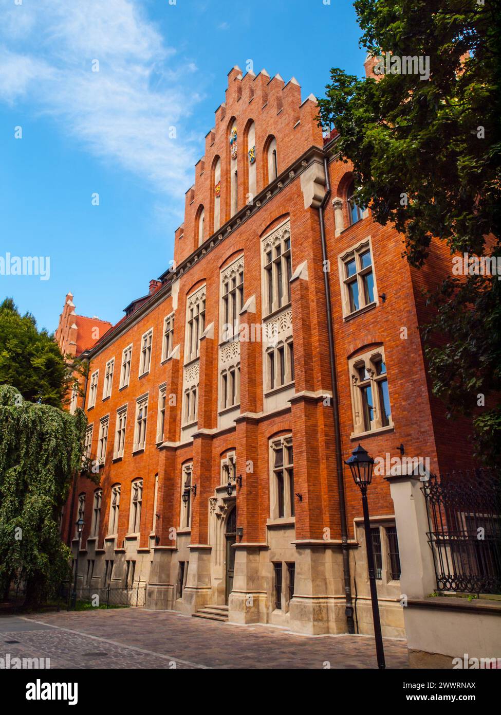 Bâtiment médiéval en brique rouge du Collegium Witkowskiego de l'Université Jagiellonian à Cracovie, Pologne Banque D'Images