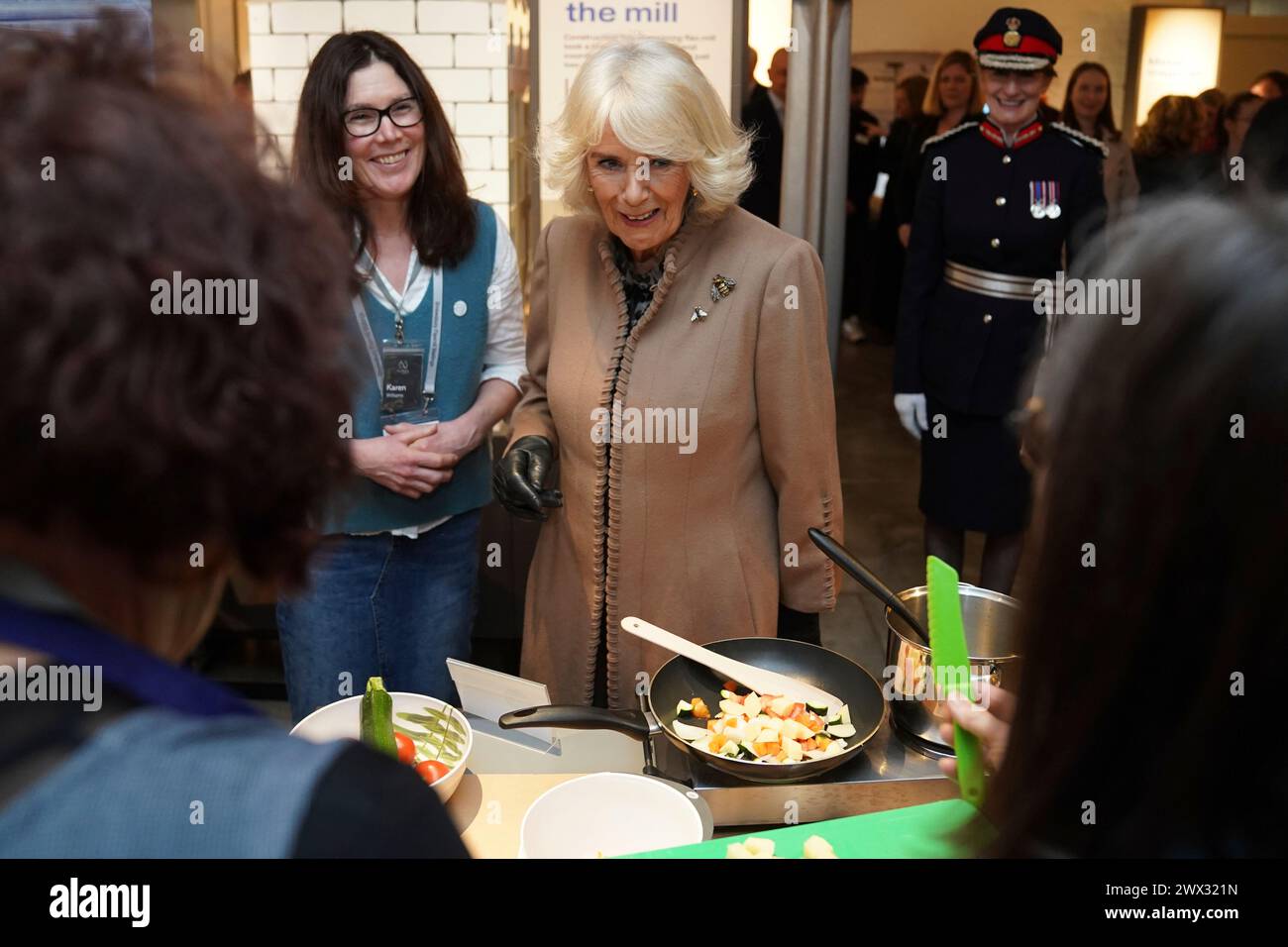 Britain's Queen Camilla meets members of local volunteer groups during a visit to the recently restored Shrewsbury Flaxmill Maltings in Shropshire, England, Wednesday March 27, 2024. (Jacob King, Pool Photo via AP) Banque D'Images