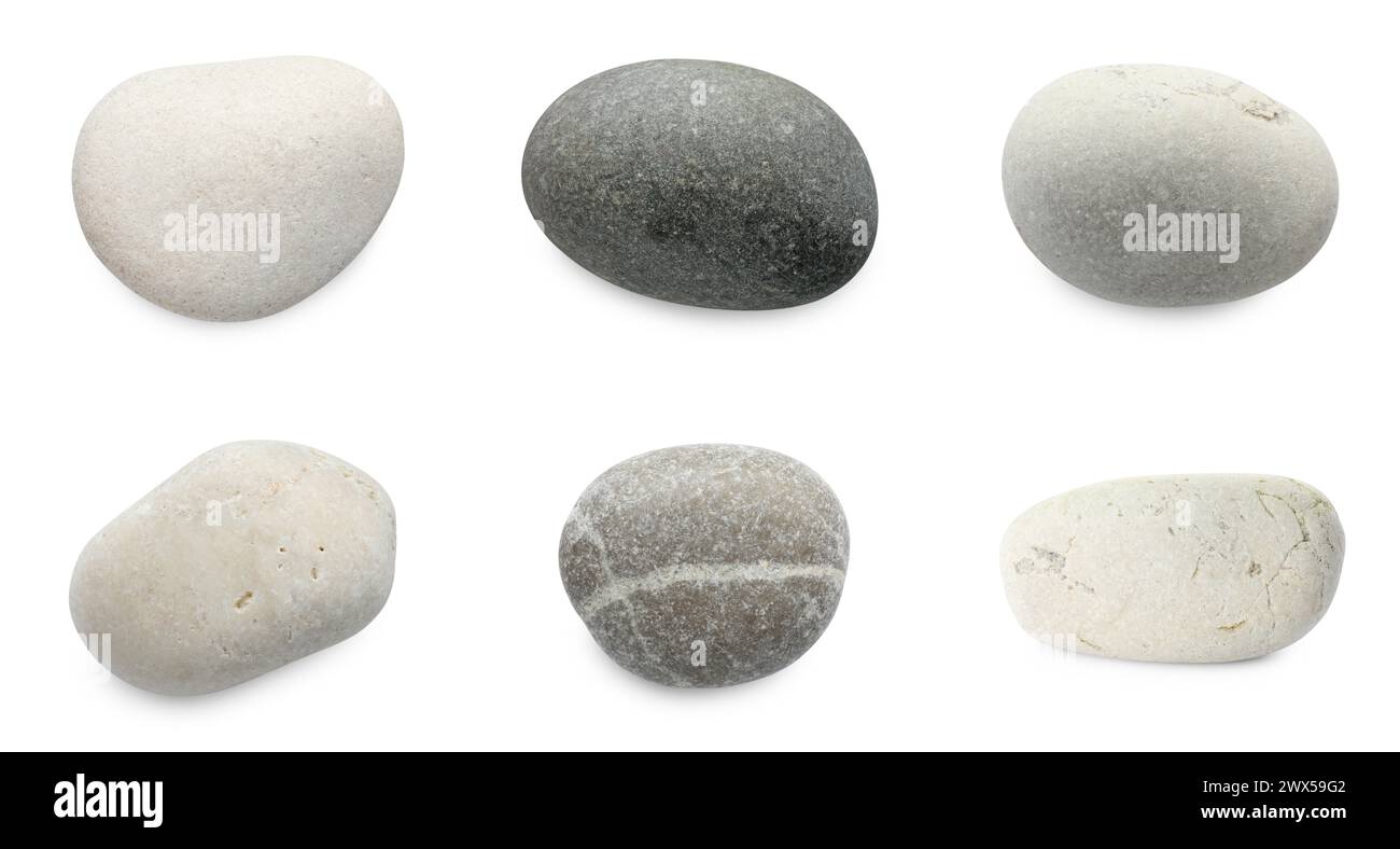 Cailloux de mer. Différentes pierres isolées sur blanc, serties Banque D'Images