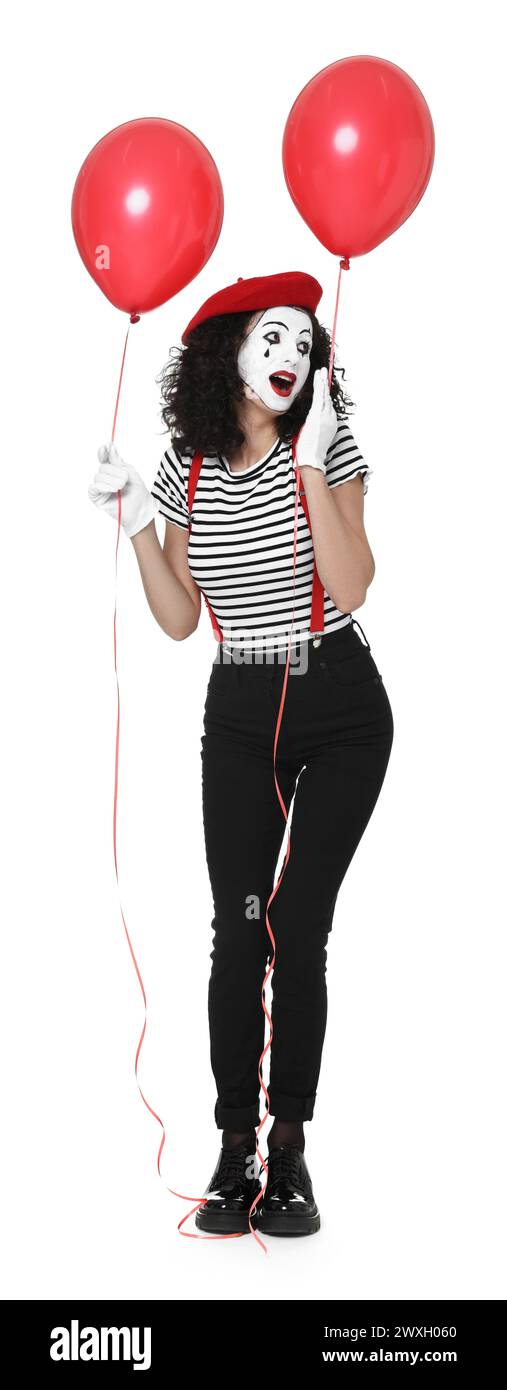 Mime drôle avec des ballons posant sur fond blanc Banque D'Images