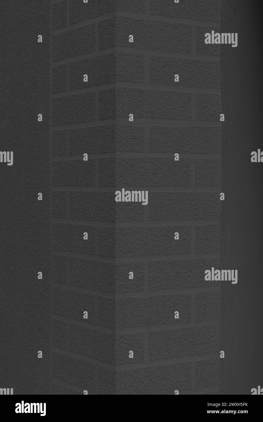 Colonne noire pilier brique abstraite motif élément détail objet architecture extérieure joint d'angle de maçonnerie. Banque D'Images