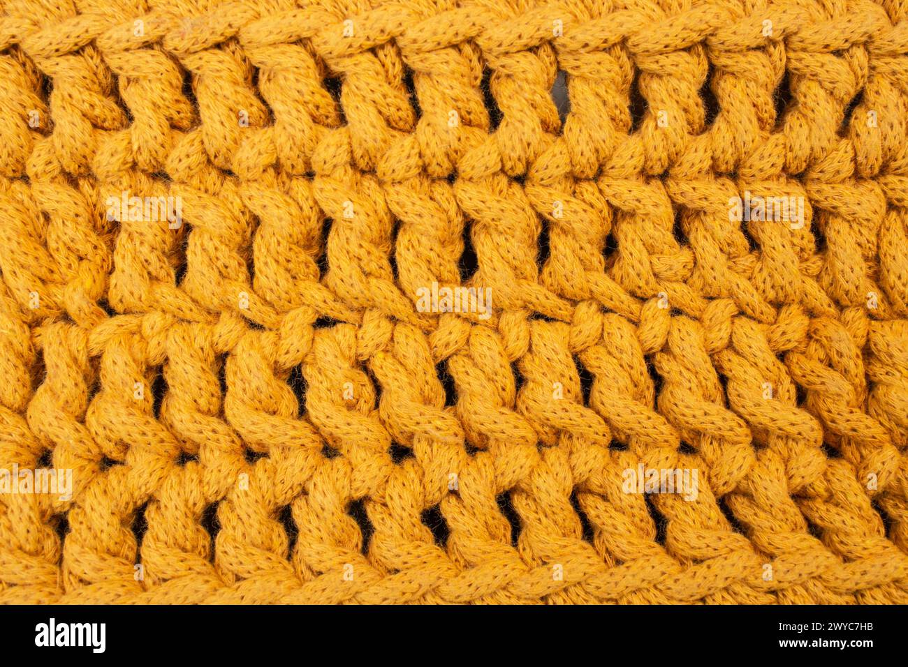 Motif de crochet de cordon de coton orange, fond de texture abstrait, soft focus Banque D'Images