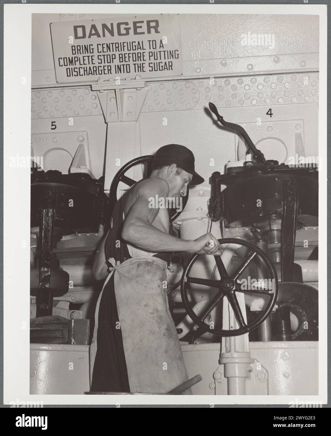 Fonctionnement d'une centrifugeuse. Usine de betteraves sucrières. Brighton, Colorado 1937 Banque D'Images