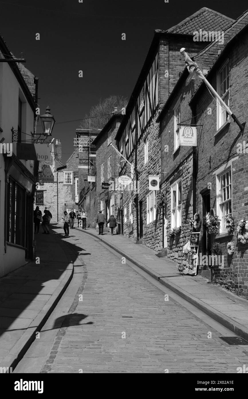 Boutiques et cafés le long de Steep Hill, Lincoln City, Lincolnshire, Angleterre, Royaume-Uni Banque D'Images