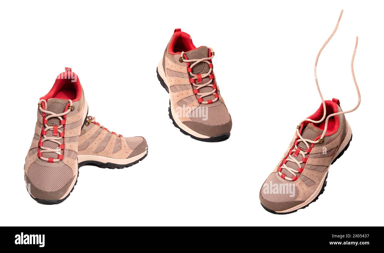 Ensemble de confortables baskets de trekking brunes neuves, bottes de randonnée imperméables avec lacets isolés sur fond blanc, chaussures modernes, daim naturel pour ou Banque D'Images