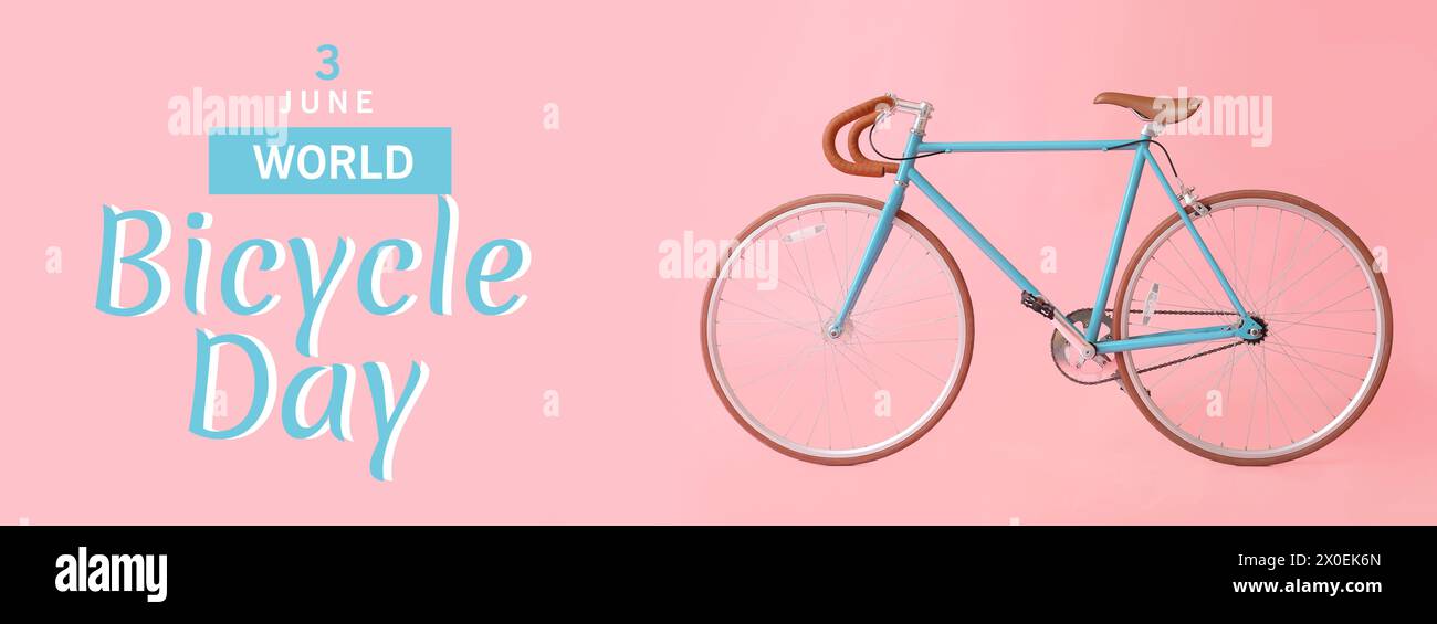 Vélo moderne sur fond rose. Bannière pour la Journée mondiale du vélo Banque D'Images
