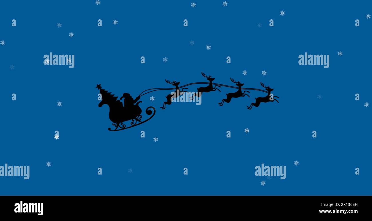 Image du père noël en traîneau avec des rennes sur la neige tombant sur fond bleu Banque D'Images