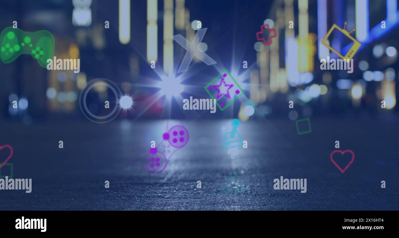 Image de plusieurs icônes de jeu d'image flottant contre la circulation urbaine la nuit Banque D'Images