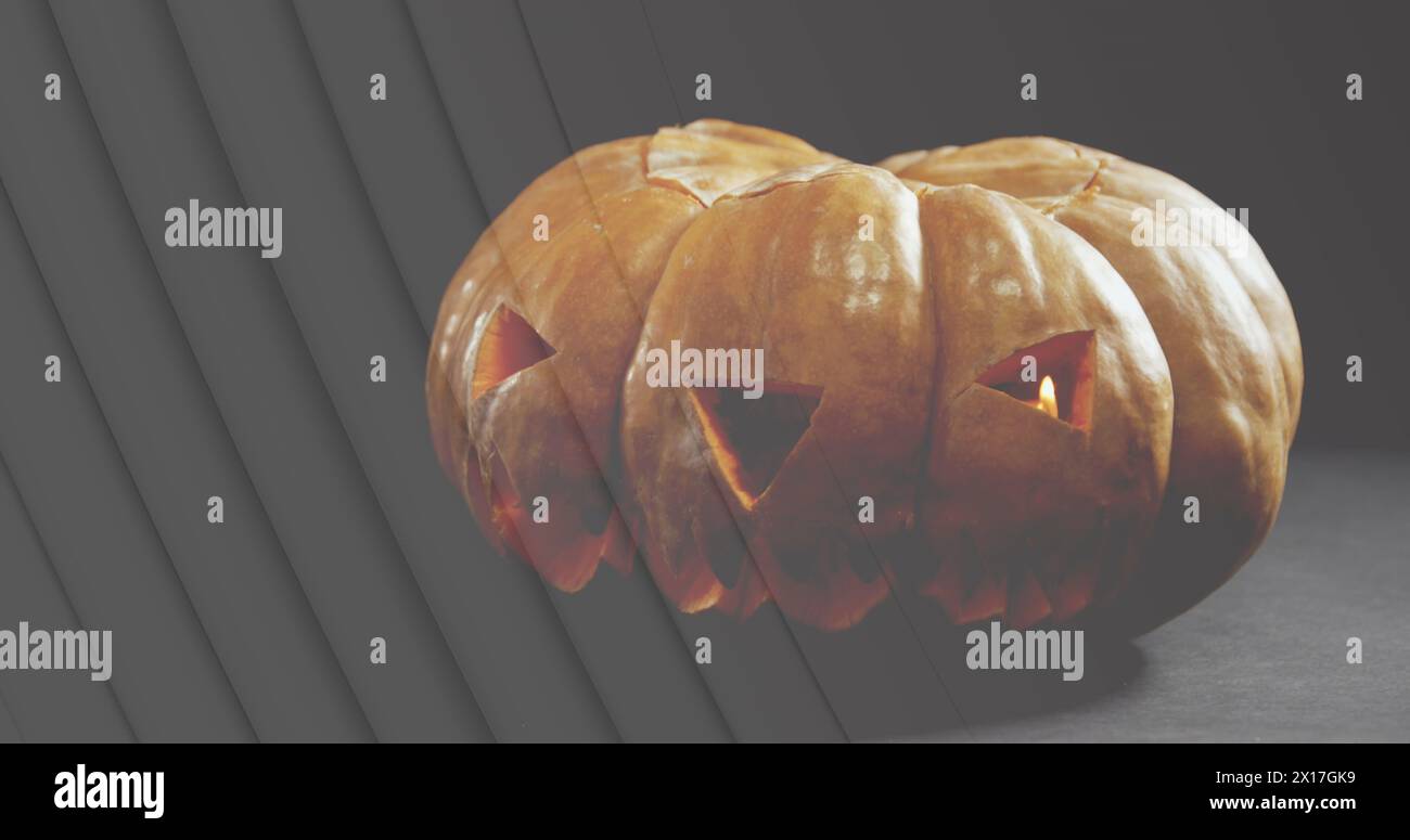 Image de lignes sur jack o lanterne citrouille halloween sur fond gris Banque D'Images