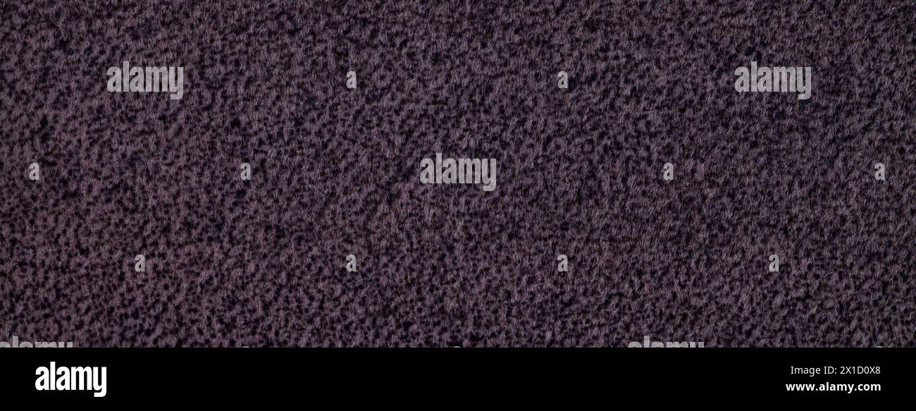 Tissu doux et molletonné violet foncé. Texture de toile de fond textile de laine violette, gros plan. Banque D'Images