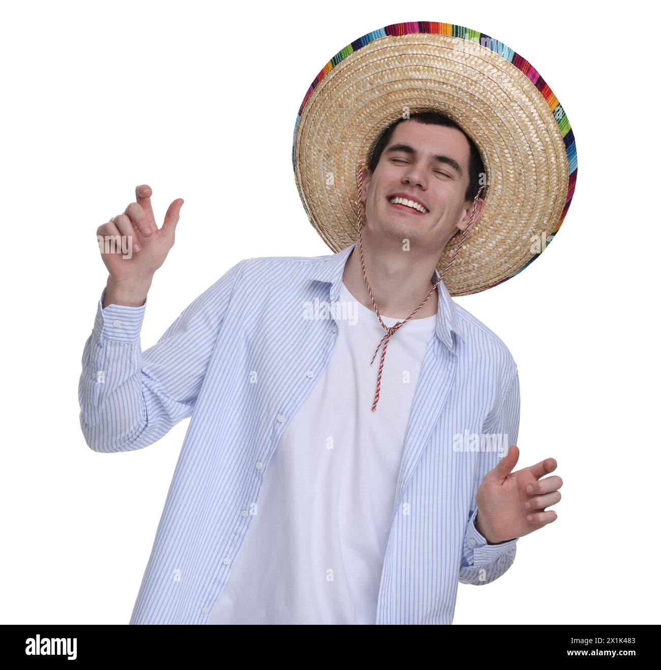 Jeune homme dans le chapeau sombrero mexicain dansant sur fond blanc Banque D'Images