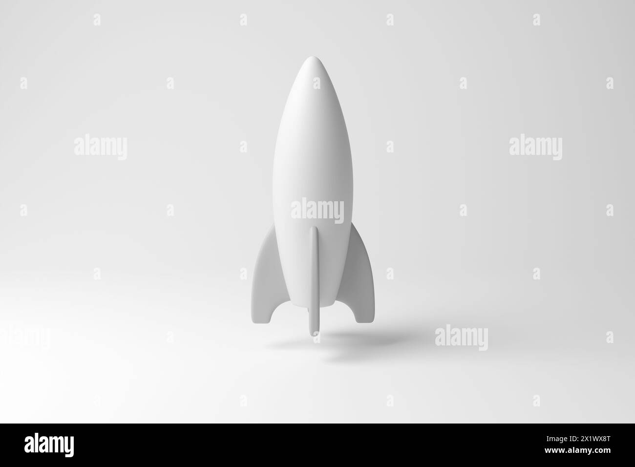 Vaisseau spatial blanc semblable à une fusée flottant dans les airs sur fond blanc en monochrome et minimalisme. Astrologie, exploration spatiale et technologie Banque D'Images