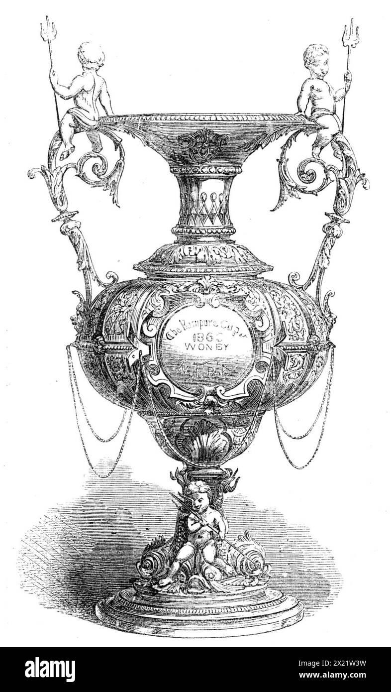 Coupe Rampoor Prize de la Northern India Rifle Association, remportée par Mr. R. G. Currie, au match de tir d'Agra, 1864. 'La Northern India Rifle Association, qui doit sa création principalement aux efforts de M. R. H. Dunlop, C.B., rassemble déjà près de 250 membres. Il tient ses réunions successivement à Agra, Bareilly, Lahore et Seetapoor, à différentes périodes de l'année. Notre gravure représente la coupe de prix donnée par son Altesse le Nuwab de Rampoor, pour laquelle les membres de cette association seront en compétition, lors de leur match le 28 décembre, à Agra. Sa valeur est de mille rupe Banque D'Images