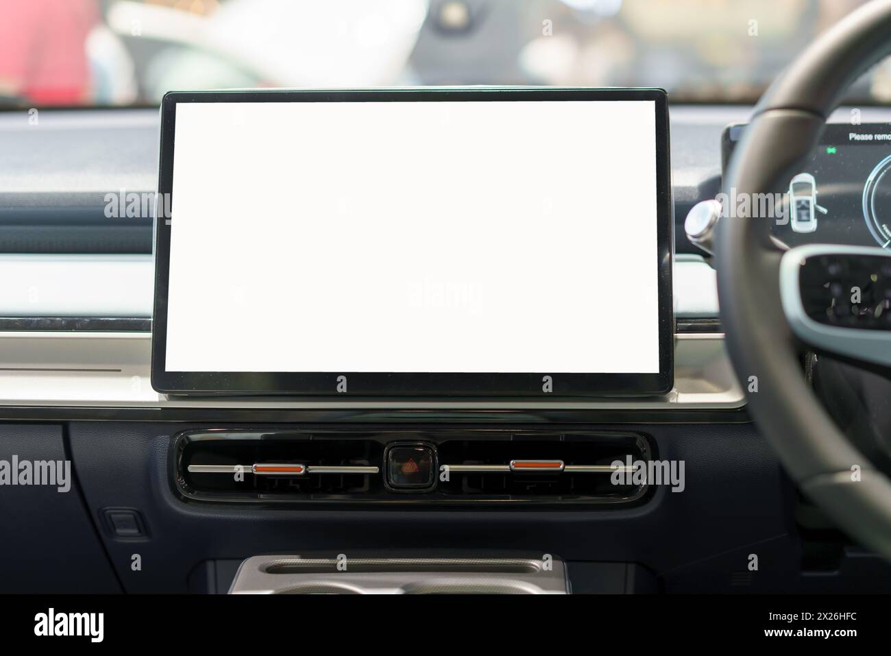 Découvrez l'avenir de la technologie automobile avec notre écran d'affichage numérique maquette blanche ornant le tableau de bord élégant d'une voiture moderne Banque D'Images